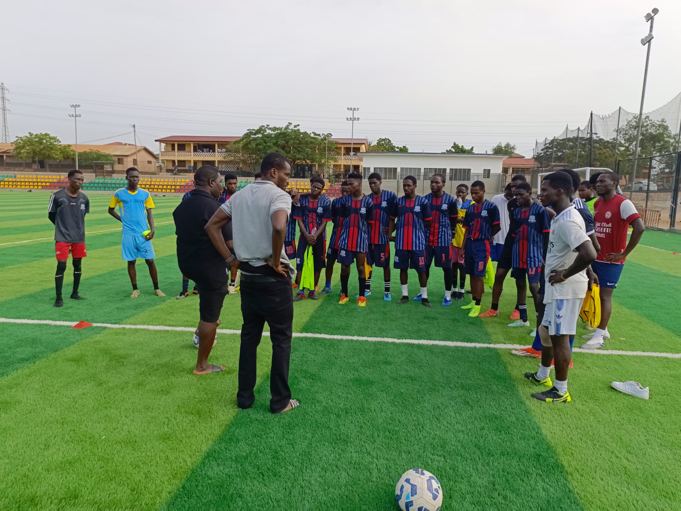 Coach guiding players at Jackmillan Football Academy
